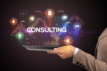 Close-up of a touchscreen with CONSULTING inscription, business opportunity concept