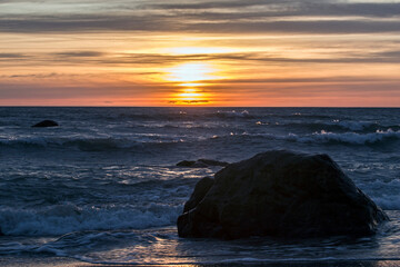 Sunset on the Baltic sea. Water area of the port of Klaipeda, Lithuania.