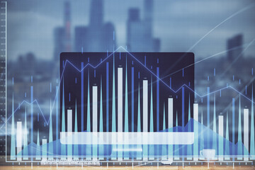 Stock market chart hologram drawn on personal computer background. Double exposure. Concept of investment.