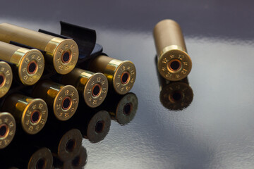 Gold cartridges on the black glossy background