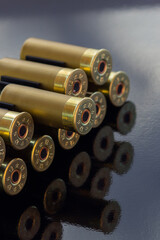 Gold cartridges on the black glossy background