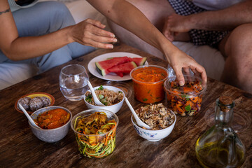 hands touching healthy food from a delivery takeaway 