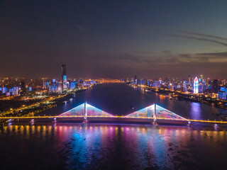 Fototapeta na wymiar wuhan light show.Panoramic skyline and buildings beside yangtze river of Wuhan china