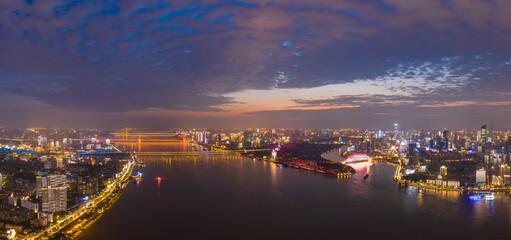 wuhan light show.Panoramic skyline and buildings beside yangtze river of Wuhan china