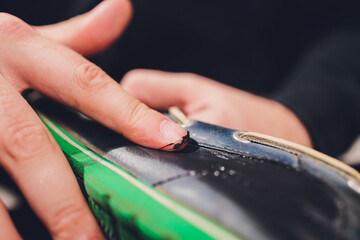 Brushes, wax, boots. applying cream with your finger. Shoe repair.