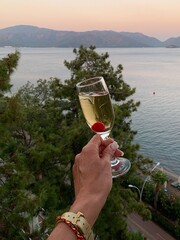 wineglass with champagne in the hands