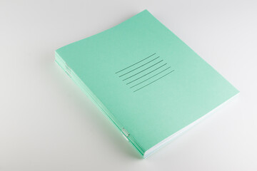 stack of thin student notebooks