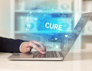 Doctor working a health check with CURE inscription, recording medical test results