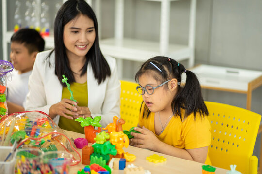disability kid on wheelchair with Autism child in special classroom