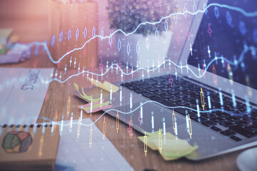 Multi exposure of forex graph and work space with computer. Concept of international online trading.