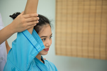 Asian beauties doing physical therapy and spa treatments from physiotherapists,select focus.