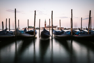 Gondolas with church of San Giorgio Maggiore in Venice, Italy on the island in the logoon