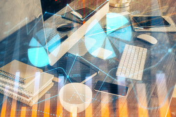 Multi exposure of graph and financial info and work space with computer background. Concept of international online trading.
