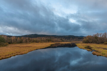 End of Lipno sea reservoir in autumn cloudy color morning