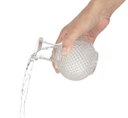 Pouring out water from a bottle isolated on white background.