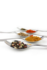 Colourful various herbs and spices for cooking on white background
