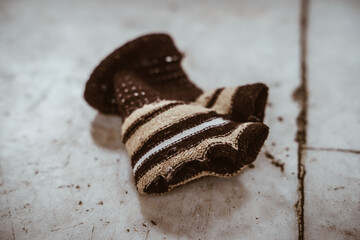 Lost baby knit glove on the floor