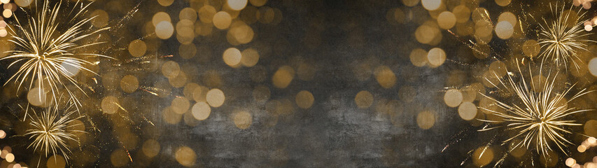 Silvester / New Year background banner panorama long- Golden firework and sparkles bokeh lights in...