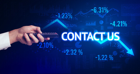 male hand holding wireless peripheral with CONTACT US inscription, modern business concept