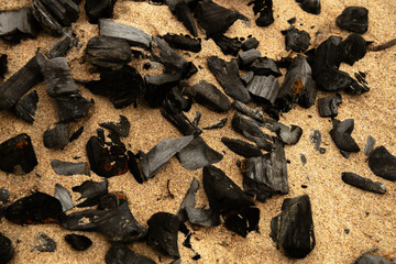 Coal scattered in the sand