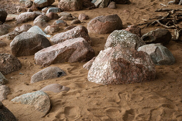 Coastal granite stones, dry trampled sand