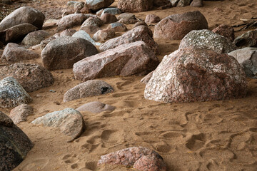 Coastal granite stones, dry trampled sand