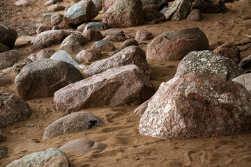 Coastal granite stones, dry trampled sand