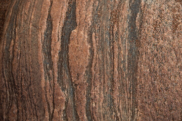Granite surface treated with atmosphere and time, shot close-up