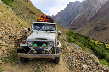 4x4 offroad car on the road from Hushe to Skardu, back from a trekking in the Karakoram mountains,...