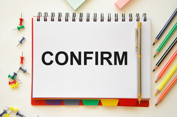  the word Confirm is written on a white notepad on a financial chart