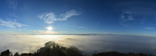 Panorama of the sea of fog from the Uetliberg on a beautiful autumn day with the Swiss Alps in the background