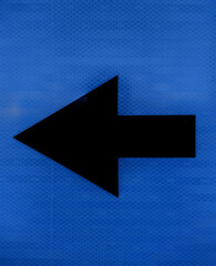 black road sign arrow wailing to the left