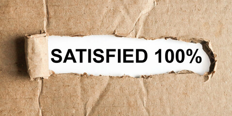 SATISFIED 100 , text on white paper on torn paper