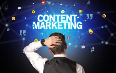 Rear view of a businessman with CONTENT MARKETING inscription, social networking concept