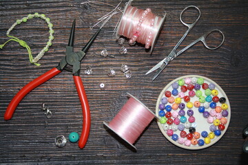Making jewelry, home workshop background.
