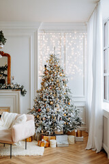 Beautiful festively decorated room with a Christmas tree. Cozy bright living room with stylish modern decor.