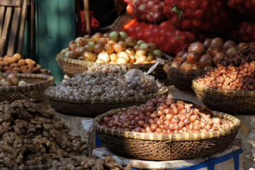 baskets with onions on a market in Vietnam Asia