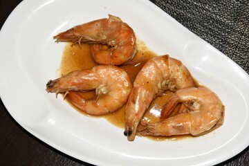 Cleaned and Cooked Shrimps in the Plate With Sauce