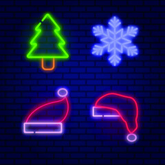 Christmas neon icons for decoration. Flake neon, Santa Claus'hats and green neon christmas tree on the bricks background