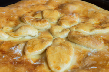 Traditional Spanish homemade dessert covered in caramelized egg decorated with a Christmas flower.