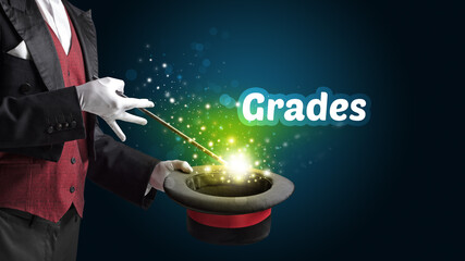 Magician is showing magic trick with Grades inscription, educational concept