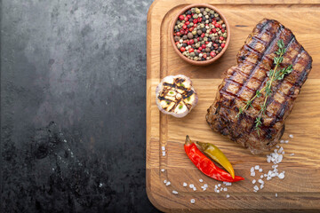 Piece of cooked rump steak with spices served