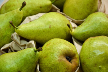 Pears background. Fresh pear fruit. Autumn fruits harvest on retro paper background. Organic farmers market products. Sweet, fresh and healthy food.