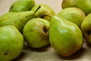 Pears background. Fresh pear fruit. Autumn fruits harvest on retro paper background. Organic farmers market products. Sweet, fresh and healthy food.