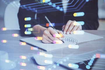 Double exposure of writing hands on background with data solution hologram on front. Technology concept. Close up