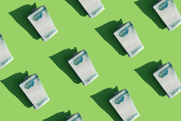 cash on a bright green background. Russian currency, rubles. Financial topic. Pattern