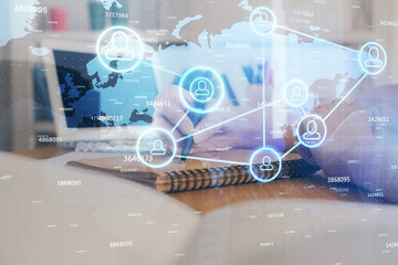 Social network theme hologram over woman's hands writing background. Concept of international people connect. Double exposure