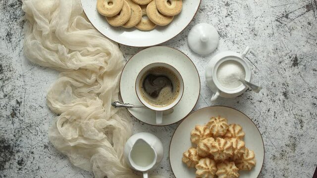 Sweet dessert concept. Golden crunchy cookies served with cup of black coffee