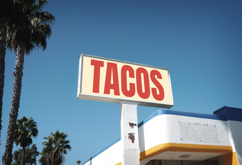 Aged and worn taco sign