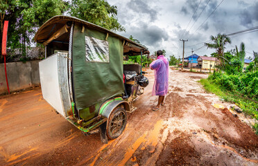 Tuk Tuk on dirt road in Cambodia.